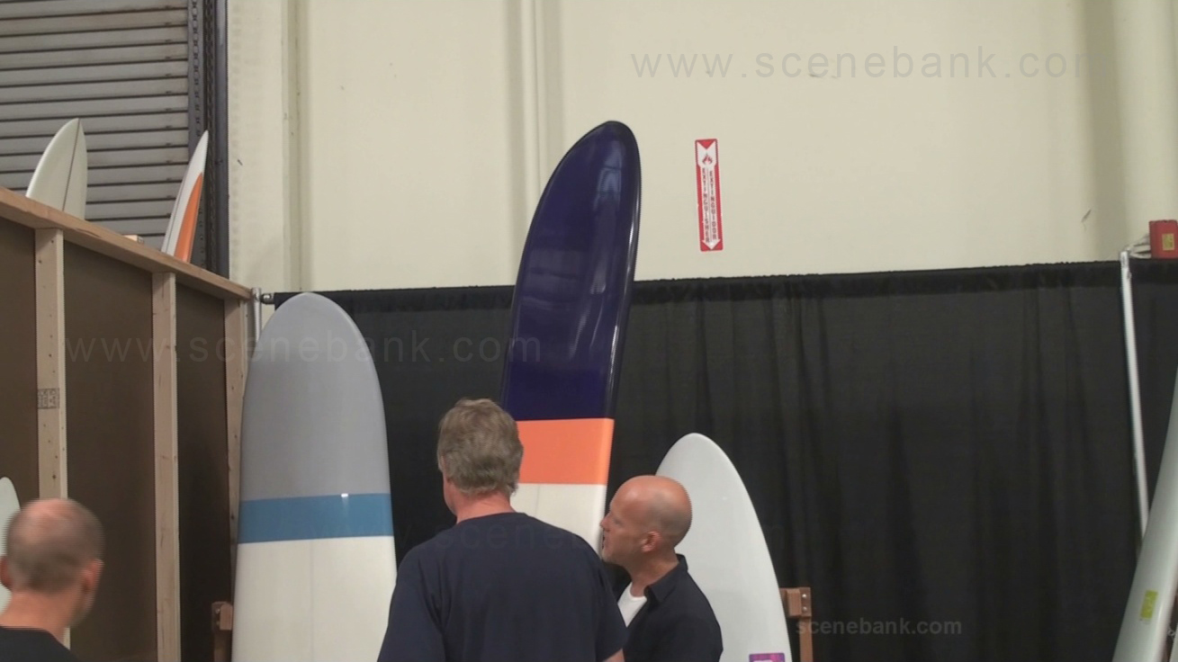 Thomas Meyerhoffer explains his 'ergonomic' surfboard design to a potential customer .