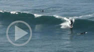 play button for playing Surfers on Huge Swells in SoCal - a HiDef video